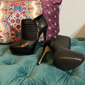 Aldo booties with gold Zipper.